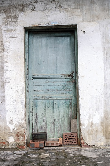 pngtree-the-old-house-was-dilapidated-with-light-blue-wooden-doors-image_992686.jpg