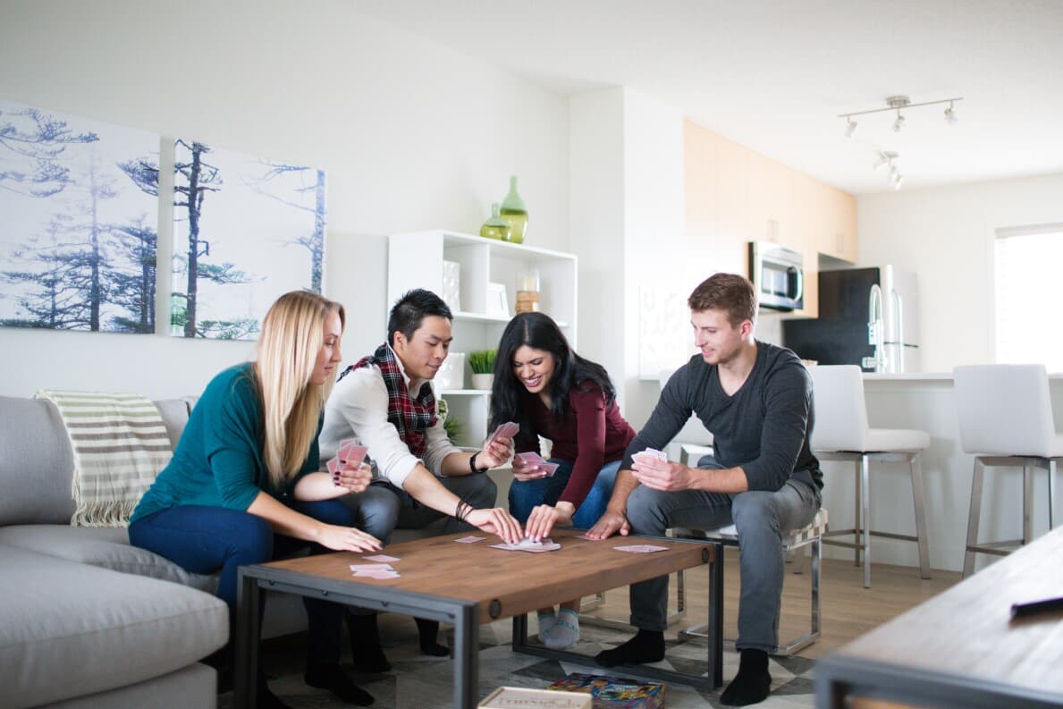 Friends having a game night in their townhome at Grove on 25th at The Orchards in Edmonton AB 1189.jpg