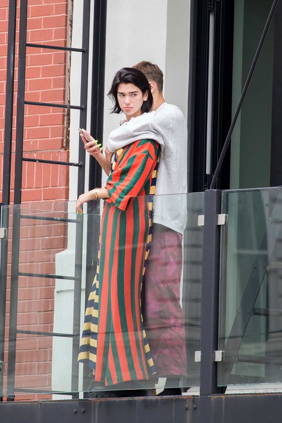 dua-lipa-and-anwar-hadid-hang-out-on-the-balcony-of-an-apartment-complex-in-new-york-city-100719_7.jpg