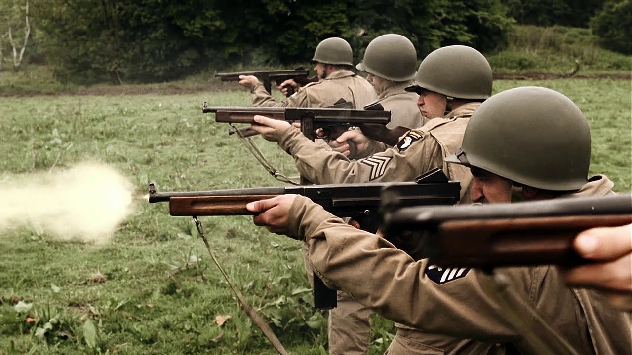 In Currahee, Easy Company men fire their Thompsons during training exercises in England..jpg