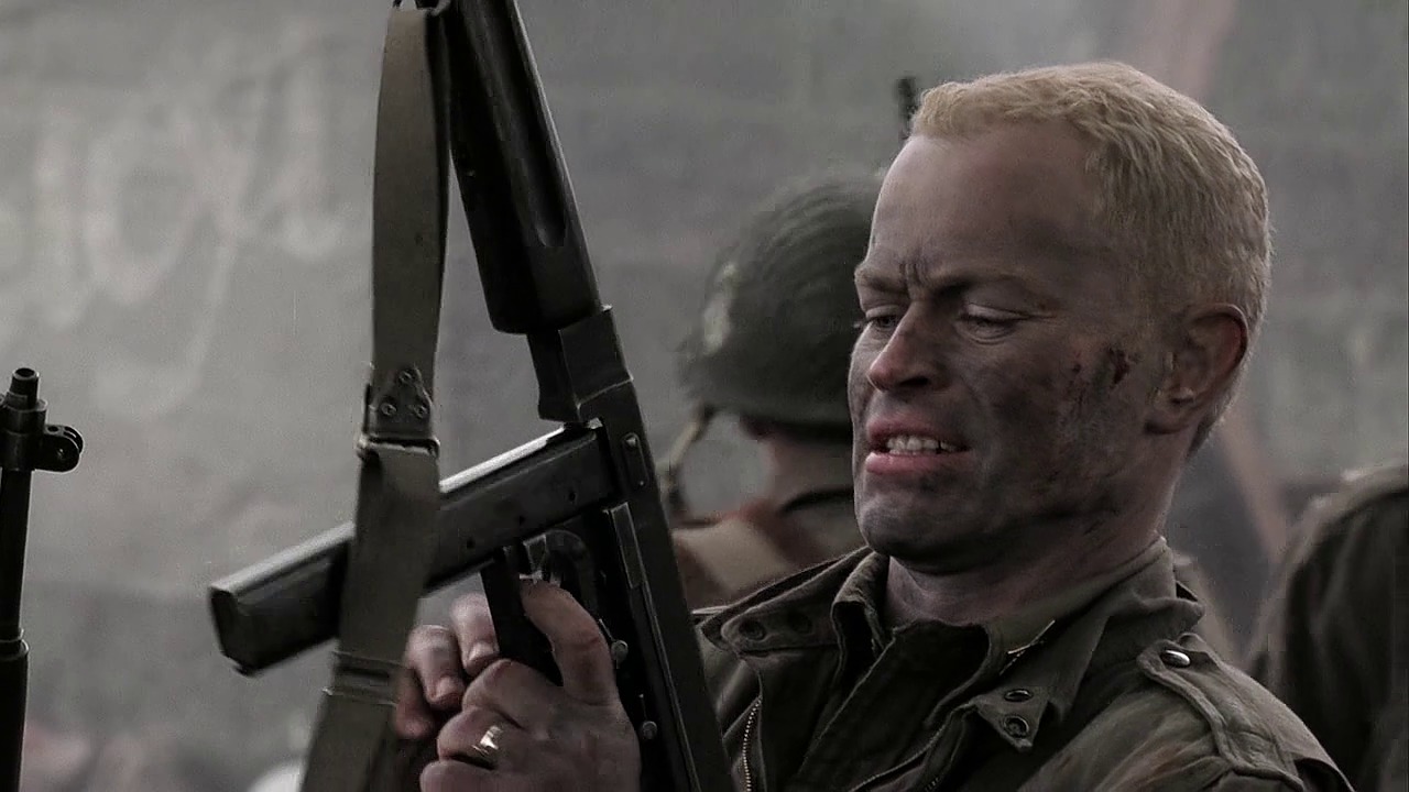 Lt. Lynn Buck Compton (Neal McDonough) loads his Thompson in Day of Days (Ep.2)..jpg