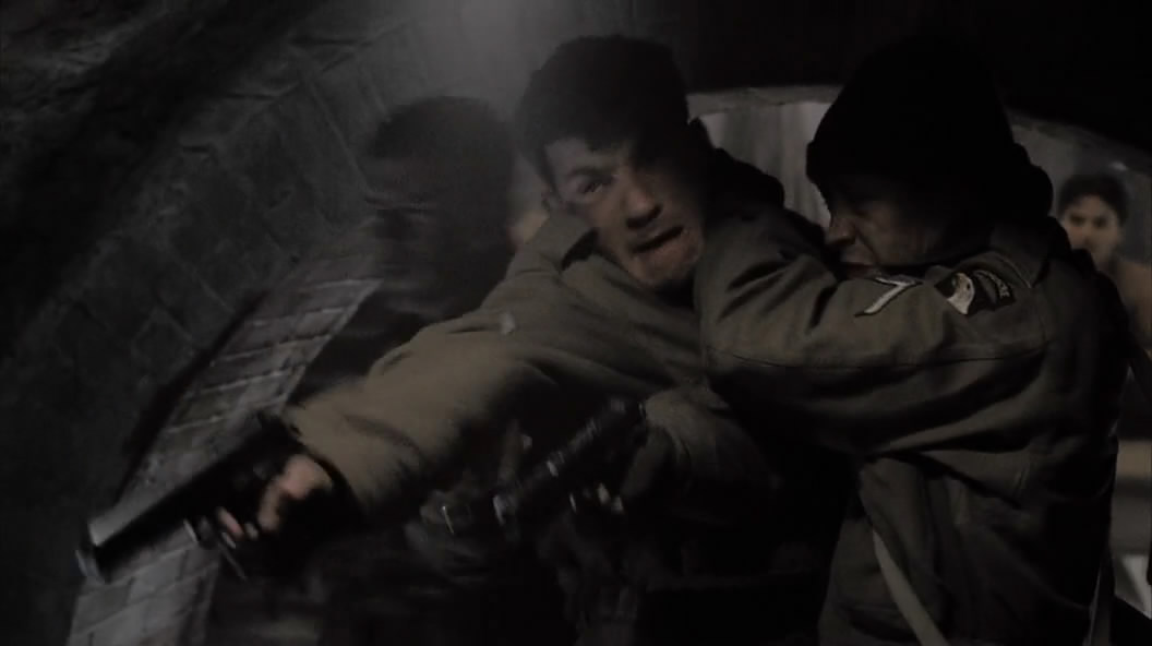 Pvt. Vest (Kieran O'Brien) angrily attempts to shoot a prisoner in The Last Patrol (Ep.8).jpg