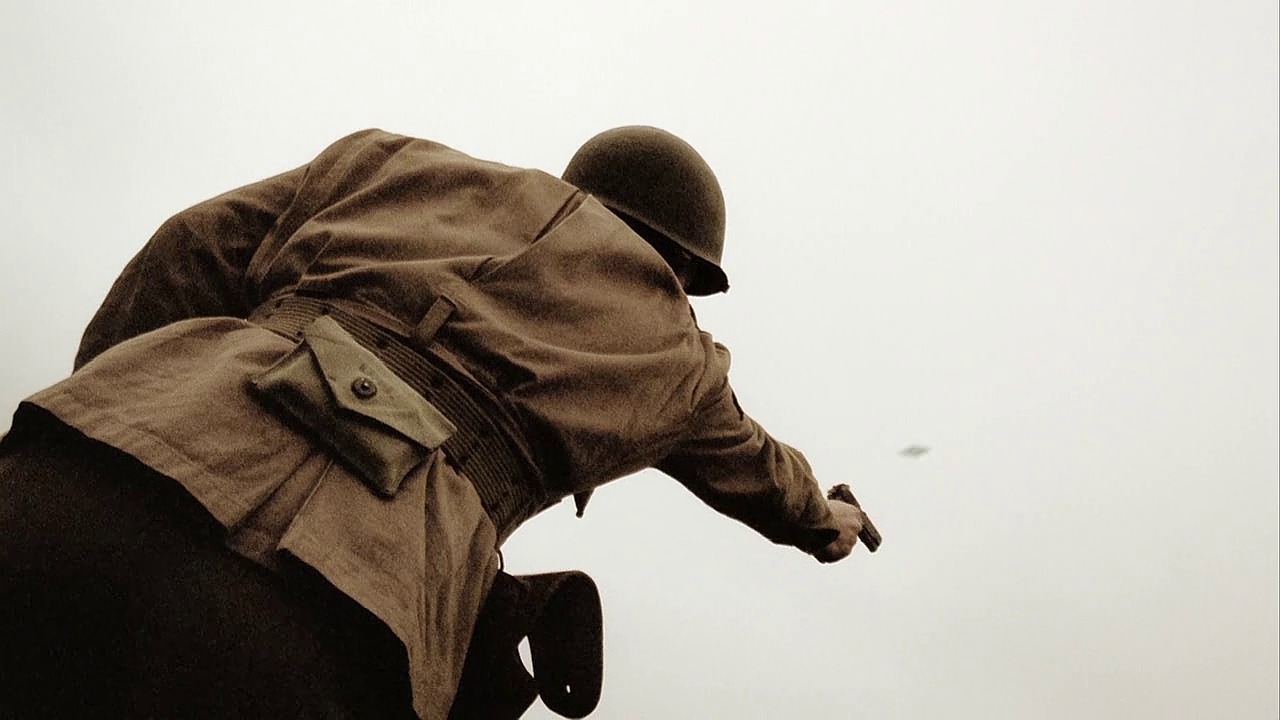 An Easy Company Paratrooper firing an M1911A1 during training exercises in Currahee (Ep.1)..jpg