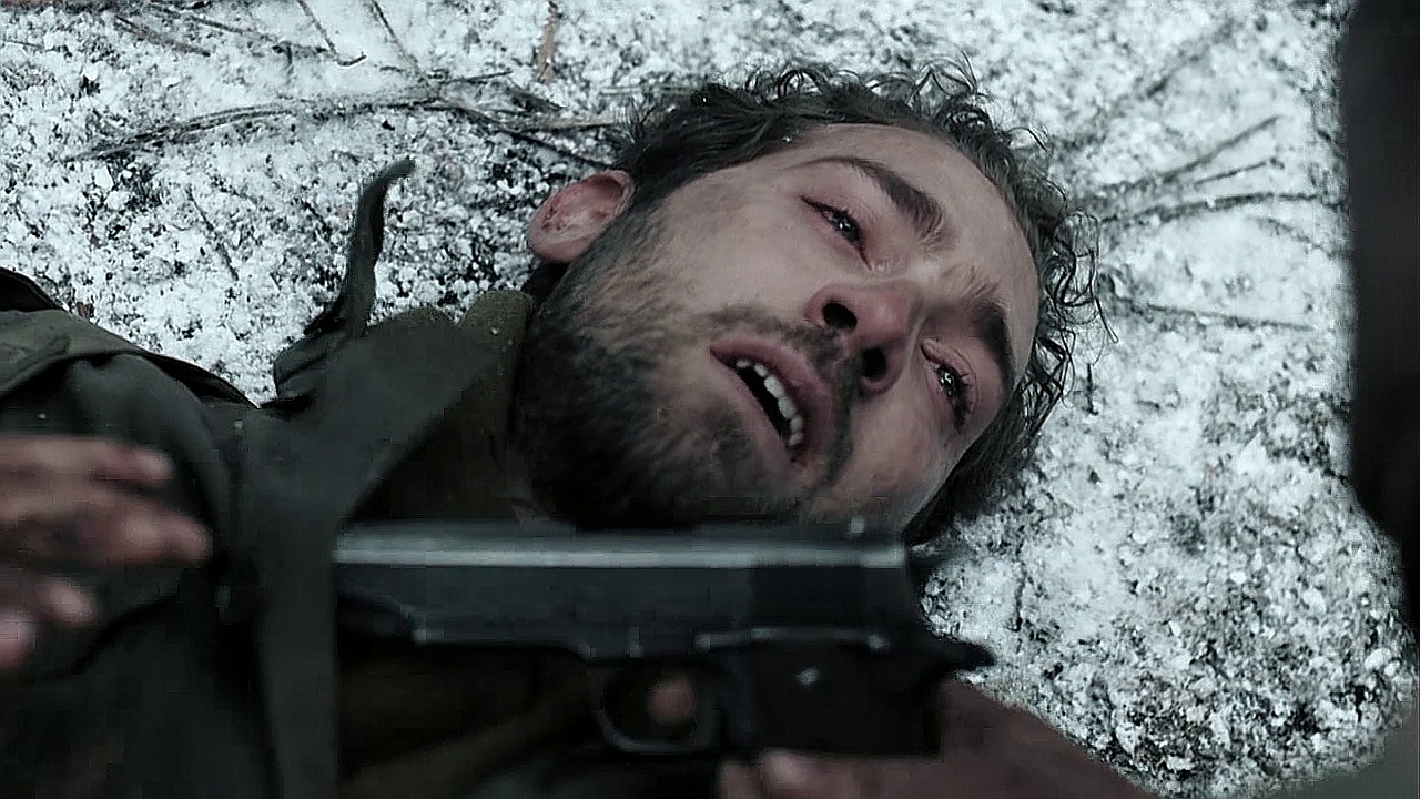 In Bastogne (Ep.6), Sgt. Alley (George Calil) pulls out Smokey Gordon's (Ben Caplan) pistol after he is wounded..jpg