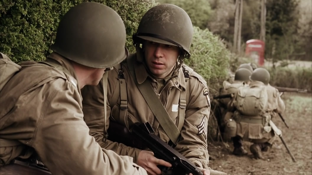 In Currahee (Ep.1), Sgt. Carwood Lipton (Donnie Wahlberg) holding an M1A1 Thompson with the bolt closed during war games.jpg