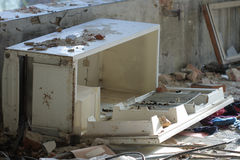 broken-refrigerator-photo-demolition-textile-factory-sunny-day-48384931.jpg